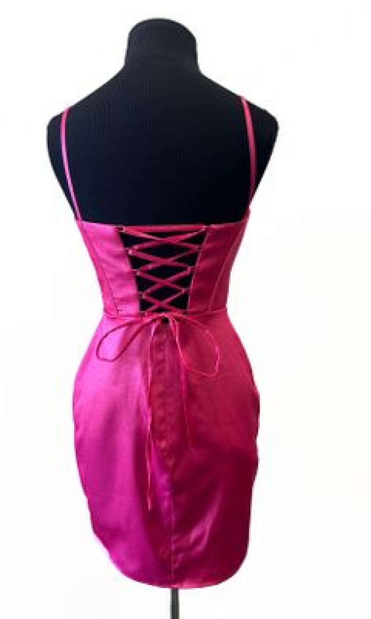 The Cowl-Neck Corset Homecoming Dress: Aerie Couture 843, in pink satin with lace-up open back and spaghetti straps, is shown from behind on a black dress form against a white background.